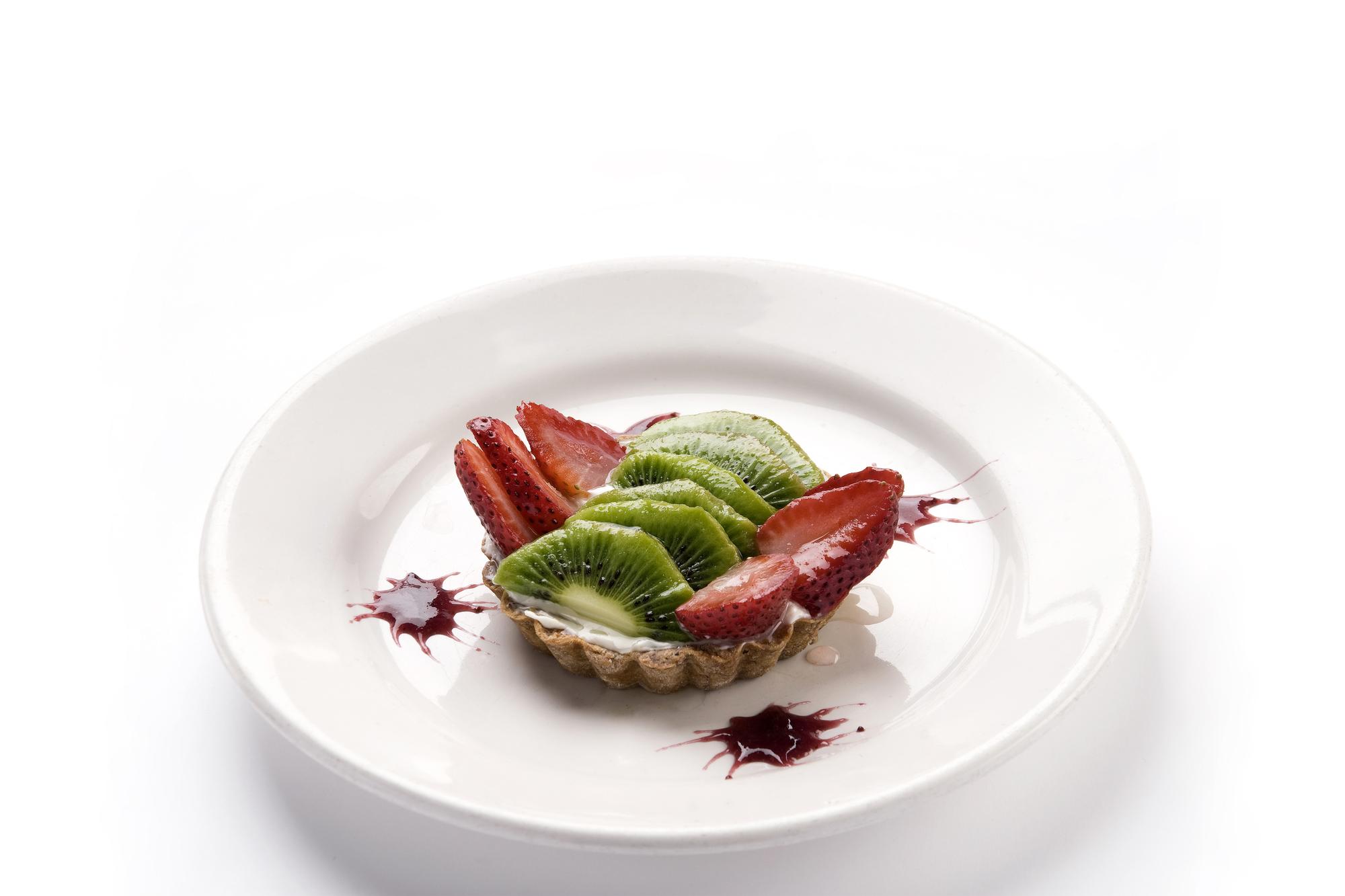 Close-up of plated seasonal menu in industrial kitchen